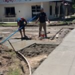 Tareas de pavimentación y drenaje pluvial en una intersección urbana de Puerto General San Martín, departamento San Lorenzo.