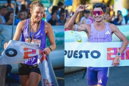 Magdalena Garrote e Ignacio Erario celebran su victoria tras consagrarse ganadores de la Media Maratón 21K de Santa Fe en el circuito de la Costanera.