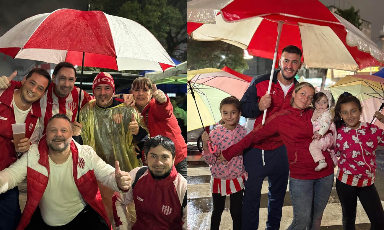 Hinchas de Unión de Santa Fe durante la vigilia por el 119° aniversario del club, en una noche marcada por la lluvia y la pasión rojiblanca. Foto: gentileza.