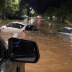 Calles anegadas y viviendas afectadas por inundaciones en Villa Minetti tras intensas lluvias.
